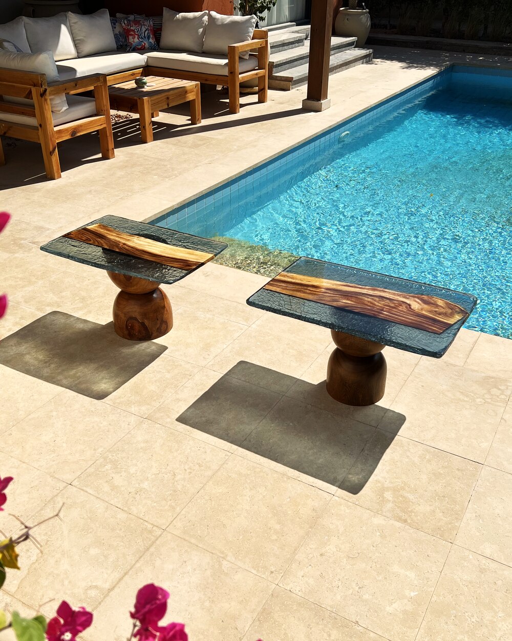 Strata — a pair of the tables by the pool on the Red Sea coast